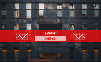 das dunkle Fassade eines Gebäudes mit einem großen, beleuchteten Schild mit der LVMH Aufschrift, mit einem LVMH NEWS Banner