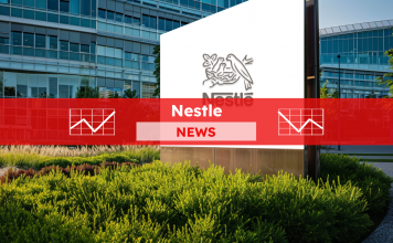 ein Schild für Nestle vor einem Bürogebäude, mit einem roten NEWS Banner