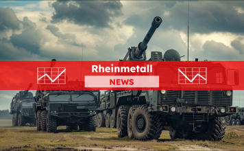 ein militärisches Artilleriefahrzeug, ausgerüstet mit einer großen Kanone, das auf einem offenen Feld neben ähnlichen Fahrzeugen geparkt war, mit einem Rheinmetall NEWS Banner