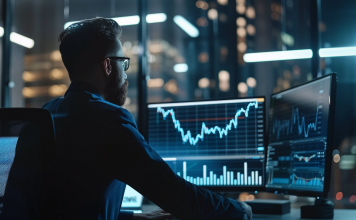 Ein Finanzanalyst im Büro überprüft ein Nvidia-Aktiendiagramm mit Aufwärtstrend